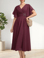 A-line V-Neck Tea-Length Chiffon Mother of the Bride Dress With Pleated Beading